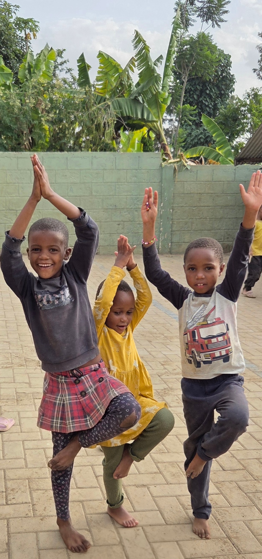 A child smiling near Mount Meru, Arusha